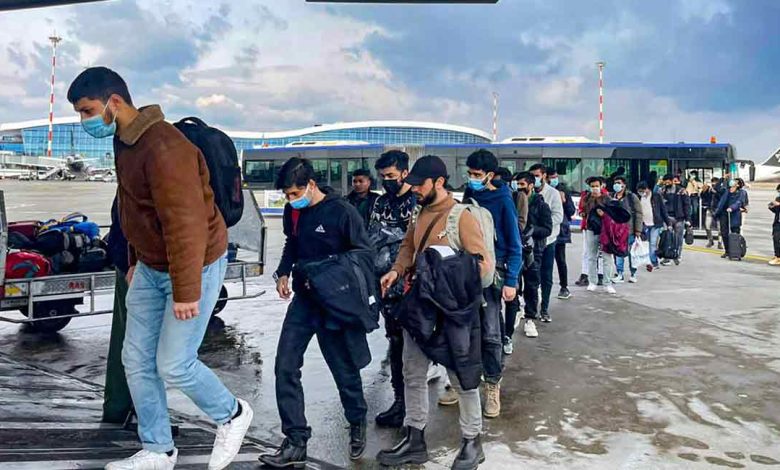 Indian students evacuated from war-zone Ukraine board an airplane to return to India
