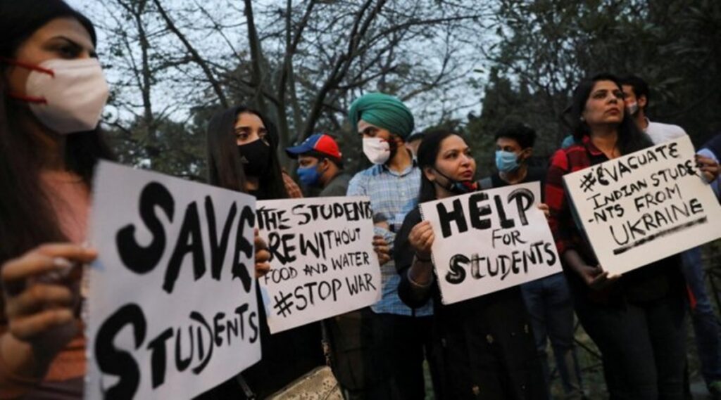 Family and friends of Indian students hold placards near Russian embassy as they demand the evacuation of stranded students. (Reuters Photo)